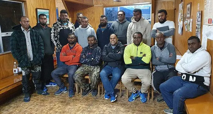 Fiji’s High Commissioner to New Zealand Filimone Waqabaca (sitting third from left) during this week’s meeting with the Fijians working under the Recognised Seasonal Employer (RSE) Work Scheme at Rod Fry Ltd and Heywood Orchards in Nelson, New Zealand.  Photo: Ministry of Foreign Affairs