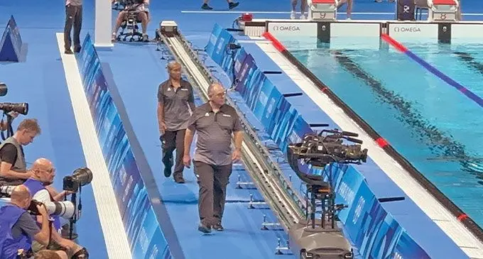 Swim coach and technical official Trisa Cheer-Dunn (behind) at the Paris La-Defense Arena, France during the Olympic Games on July 30, 2024. Photo: Courtesy of Fiji Swimming