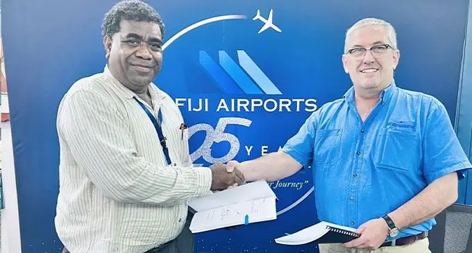 Fiji Airports general manager assets and infrastructure Kelepi Dainaki (left), and RATE Australia Pty Ltd managing director Peter Reidy, at the Fiji Airports headquarters in Nadi after signing the $10.4 million aerobridge contract Photo: Fiji Airports