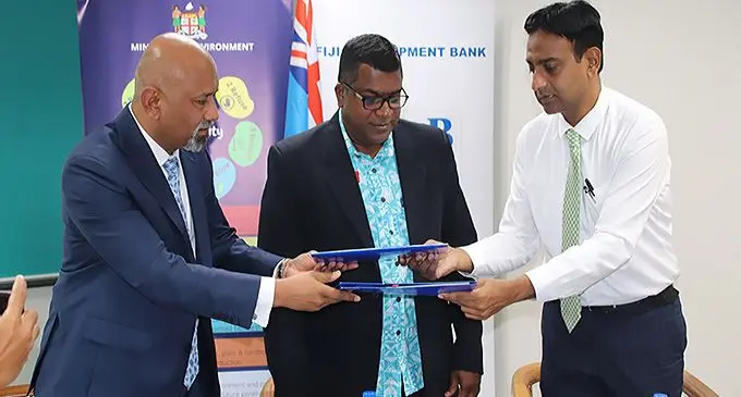 Fiji Development Bank chief executive officer, Saud Minam, with Minister for Agriculture, Mahendra Reddy, and Permanent Secretary for Environment, Joshua Wycliffe, during the MoU signing in Suva on April 13, 2022.