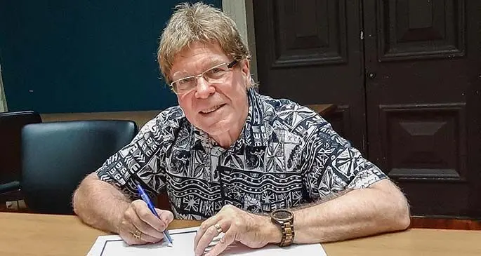 Acting Vice-Chancellor Professor James Pounder signs the Memorandum of Understanding with Crystal Delta