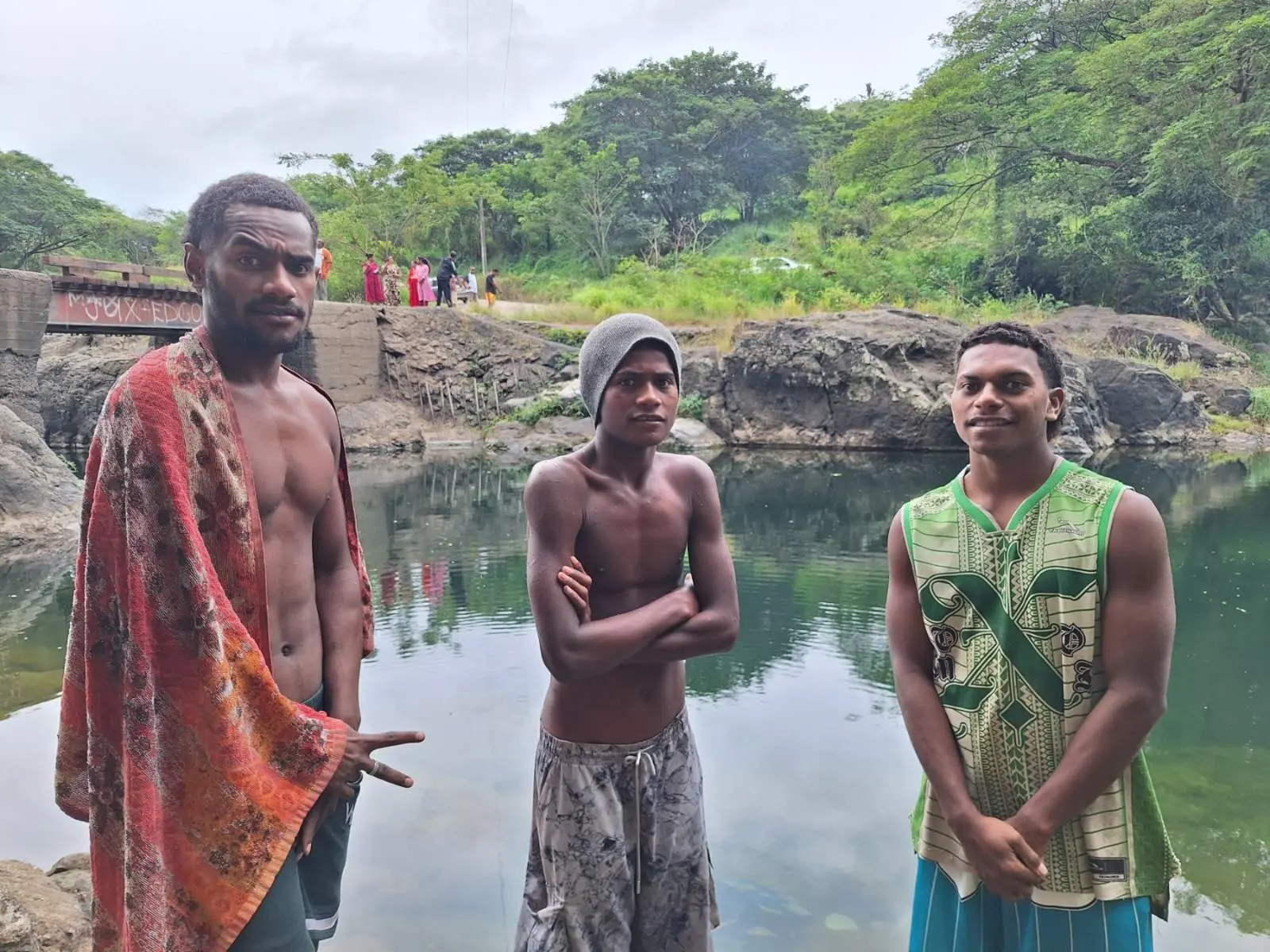  (From left) Iowane Corivuka, Jasa Yalayala, and Sakiusa Rabuli at the Nasivi River, where they joined efforts to retrieve victims from a vehicle that plunged into the water.