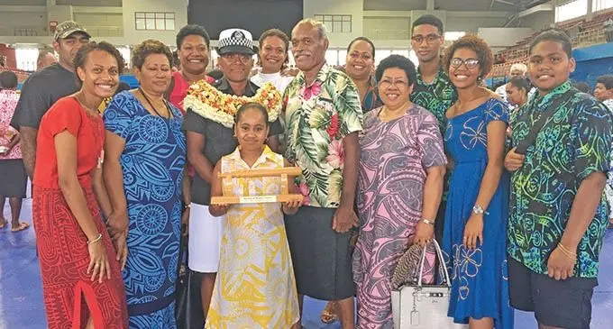 Police officer Ulamila Karisitiana (garland) with her proud family members after the passing-out parade at the Vodafone Arena in Suva on January 17, 2020.  Photo: Renu Radhika