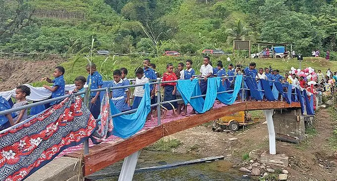 Nailagobokala Primary School students cross on the newly-built bridge at Nadovu, Naitasiri.