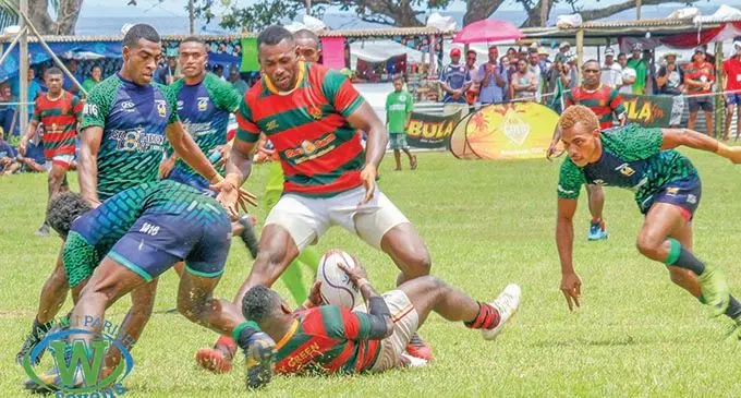 Ram Sami Army Green prop Sevuloni Mocenacagi comes in to support Asaeli Tuivuaka (on the ground) during the Fiji Bitter Wairiki 7s Carnival in Taveuni on December 3, 2020. Photo: Fiji Bitter Wariki 7s