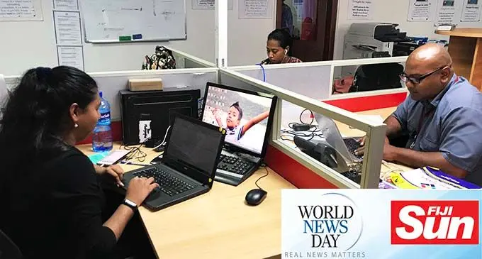 Journalists in the Fiji Sun newsroom.