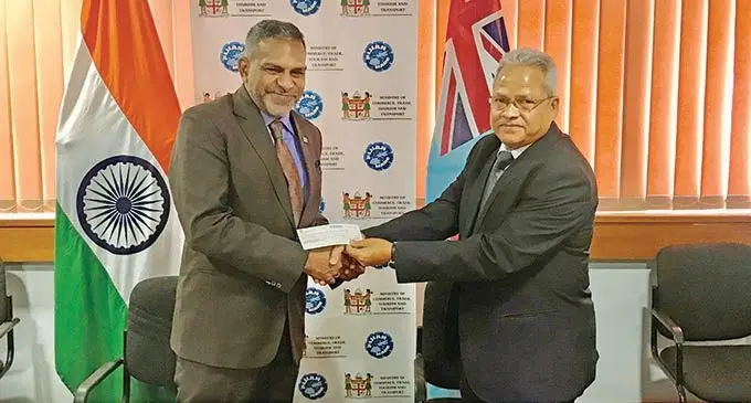 Minister for Commerce, Trade, Tourism and Transport Faiyaz Koya receives a cheque from the Acting Indian High Commissioner to Fiji Sukanta Sahoo on March 18, 2021. Photo: Inoke Rabonu