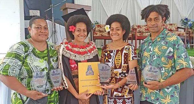 Raluve Tubuna Tadu Varuru (second from the left), with her parents Titilia Leba {left) and Peter Earley and twin sister Vika Varuru during the graduation at the Civic Centre in Labasa on December 10, 2024. Photo: Shratika Naidu