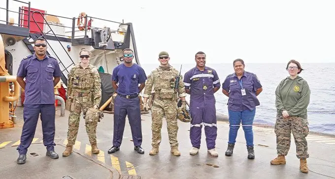 Fisheries Enforcement Officer, Akosita Cavora (second from right), a shiprider on board the U.S Coast Guard Cutter Juniper. Photos: Ministry of Fisheries and Forestry
