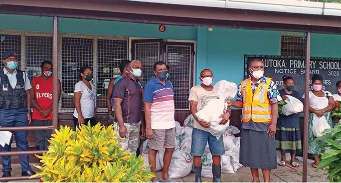 The Minister for Youth and Sports Parveen Bala Kumar (fifth from left), Calfornia lovu seaside spokesman Manuelu Sovau and Commissioner West Mesake Ledua (fifth from right) at the Lautoka Primary School on January 12, 2022. Photo: Salote Qalubau