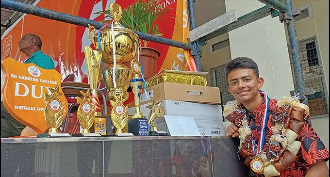 Ba Sanatan College student and dux awardee Shifraaz Shohal Khan with his awards on December 9,2022. Photo: Salote Qalubau