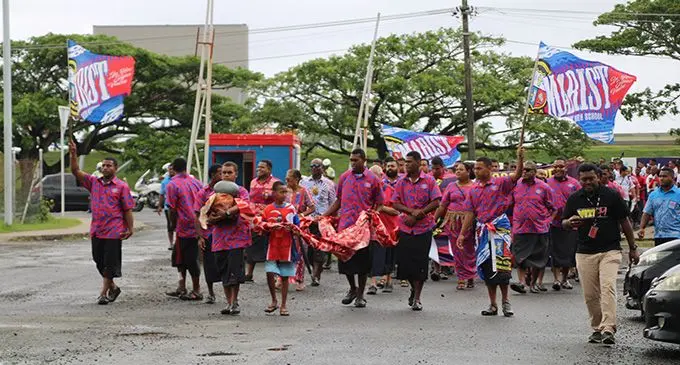 Members of the Marist U18 team marching along Laucala Bay Road on October 22, 2022. Photo: Leon Lord
