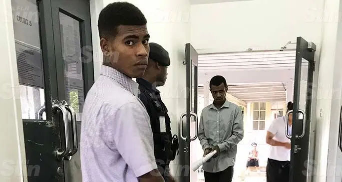 Emosi Tabuasei (grey long sleeve shirt) and Alivio Kalokalodromu (purple shirt) outside the Magistrates Court in Suva on April 27, 2020. Photo: Ashna Kumar