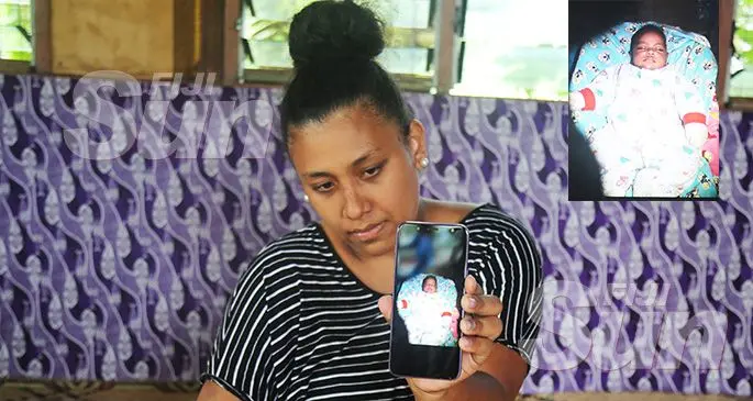Distraught mother Mereseini Raulini holding a picture of her four month-old baby Suliana Talemaitoga. Photo: Jennis Naidu Inset: Baby Suliana.