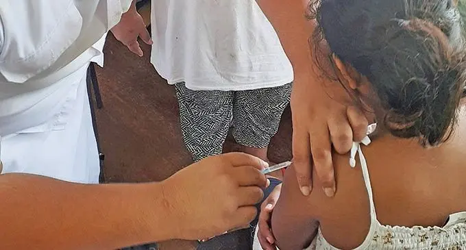 Samabula Health Centre Staff Nurse, Emmanuel Pene assists 10 year-old Pisila Gino of Tuvalu with free measles vaccination on November 13, 2019.  Photo: Ronald Kumar