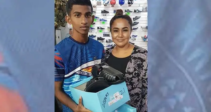 Kaajal Kumar (right) with a recipient of her Shoe 4 Fijian Child Initiative.