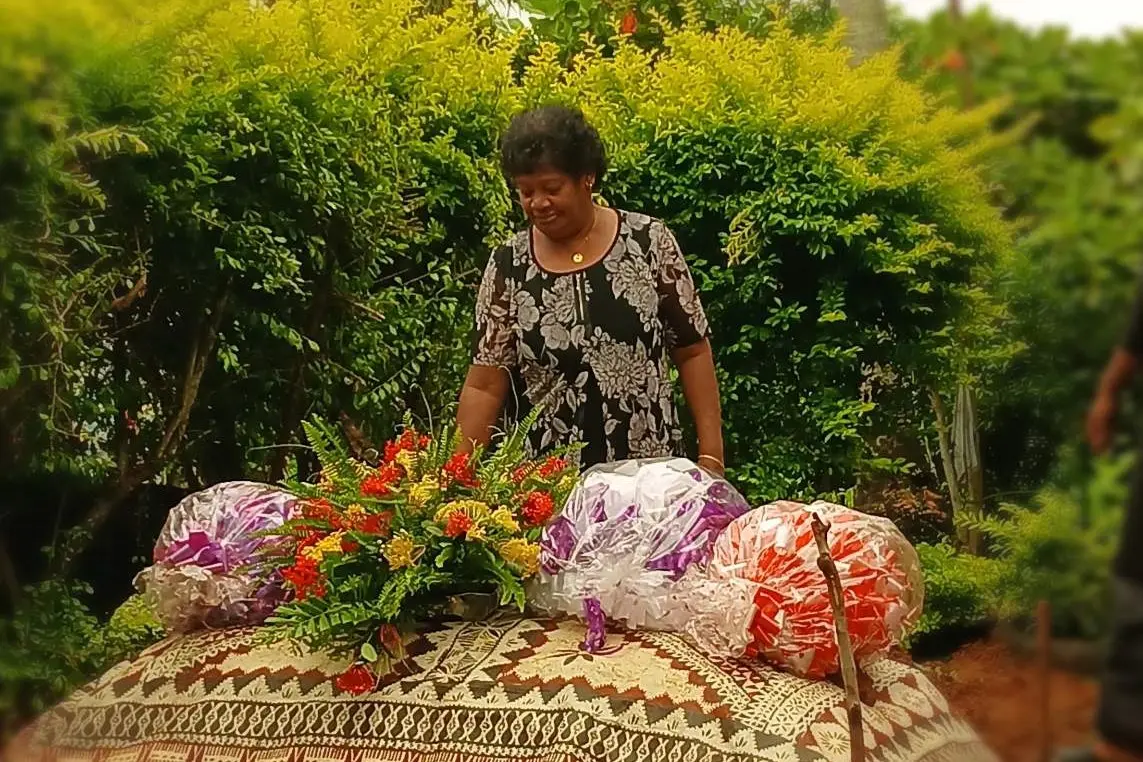 Grieving mother, Adi Vasiti Ranadi, at her daughter’s burial.