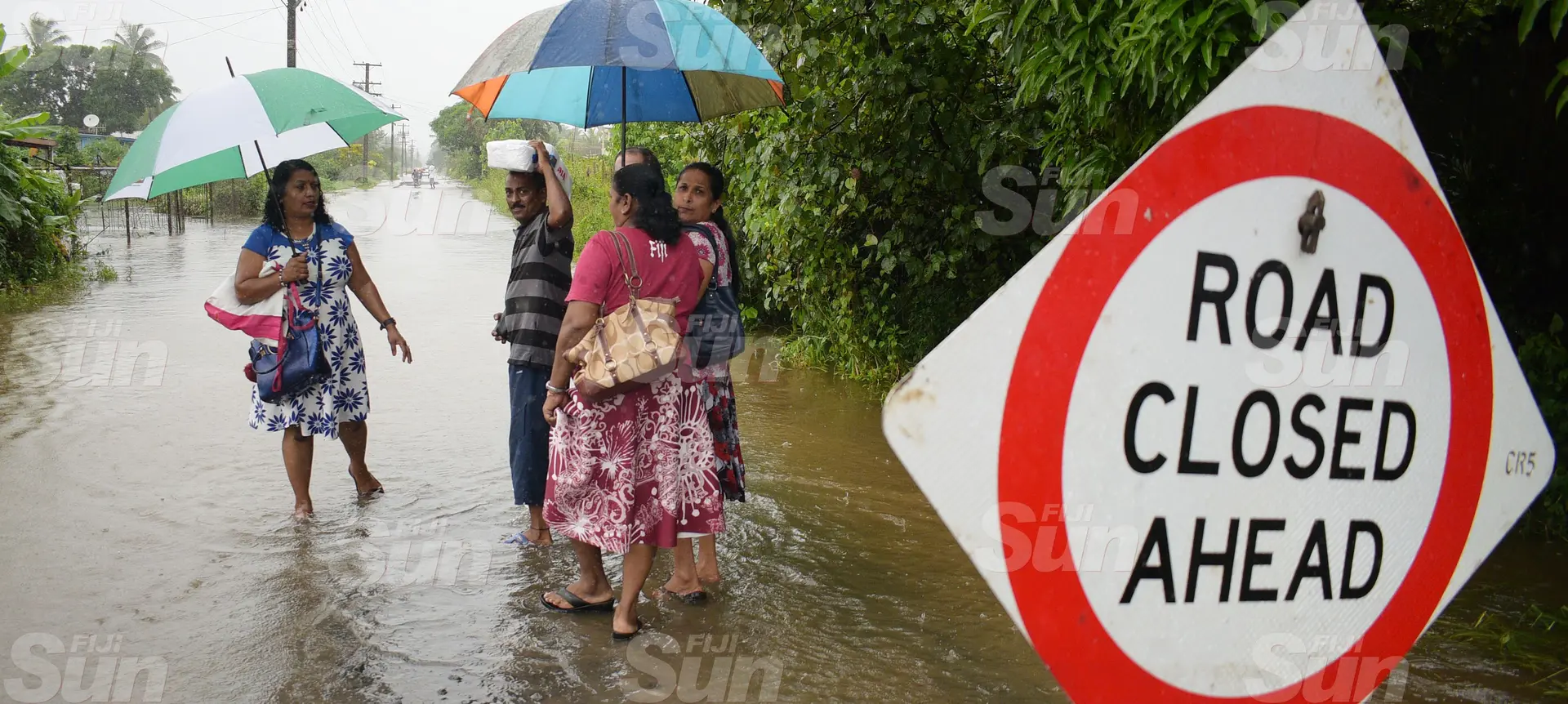 Naduru Road residents of Nausori had to walk through the flooded road as their road was closed dur to flooding on March 20, 2020. Archive Photo: Ronald Kumar.