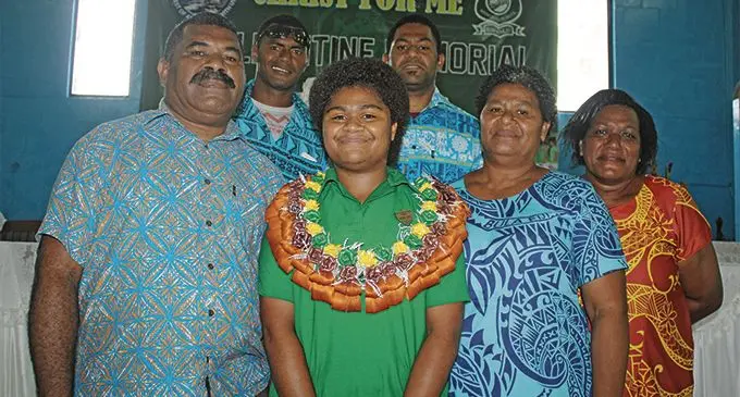 From left front: Peceli Dere (father), Ballantine Memorial School head girl Kesaia Mere, Merewai Rita (mother), Mere Coa (aunty) with Mere’s brothers (from left back) Esala Ravouvou and Josateki Momo after the prefect induction on February 2, 2019. Photo: Simione Haravanua