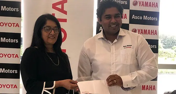From left; Fiji Paralympics Committee president and senior Fiji Airways executive Shaenaz Voss receives the cheque from Asco Motors chief executive officer Craig Sims in Suva March 5, 2019.  Photo: Grace Narayan