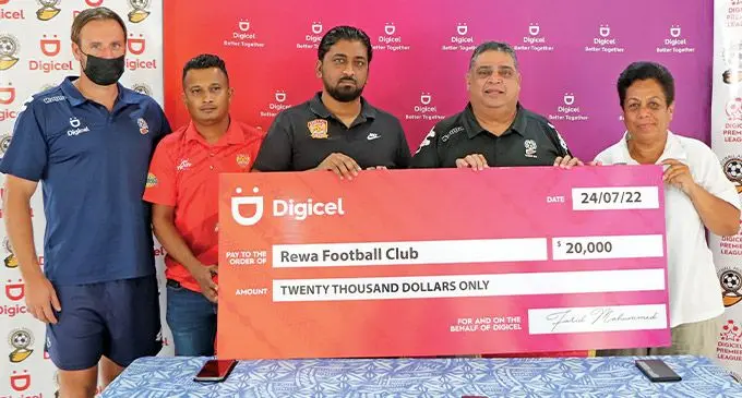 Fiji Football Association president Rajesh Patel (fourth from left) hands the cheque to Rewa Football Association president Nazeel Buksh at Fiji FA Academy in Vatuwaqa, Suva, on July 24, 2022. Photo: Fiji FA Media