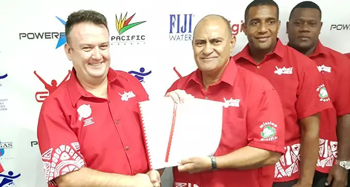 From left: Coca- Cola Amatil Fiji general manager Roger Hare shows the newly signed agreement with Fiji Secondary Schools Athletics Association president Ratu Marika Uluinaceva along with teachers at the Coca-Cola head office at Laucala Beach, Suva on March 12, 2019.  Photo: Leone Cabenatabua