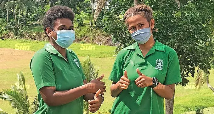 Year 12 students of Ballantine Memorial School Perina Matai, 17, and Salome Naitoko, 18, ready for classes on November 1, 2021. Photo: Inoke Rabonu