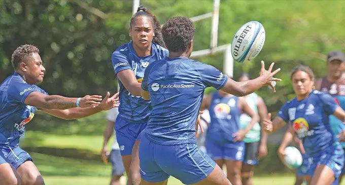 Rooster Chicken Fijiana Drua strong running second five eight Merewai Cumu (left) flicks a pass as Doreen Narokete closes in during training at Suva’s Bidesi Park on April 5, 2023. Photo: Ronald Kumar