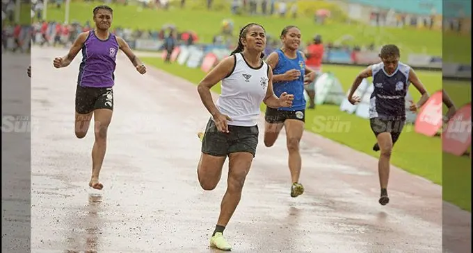 Repeka Rosi of Adi Cakobau School (ACS) (left) wins the senior girl’s 100 metres heats of the Triple N Zone, she later won the finals at the HFC Bank Stadium on August 2, 2022. Photo: Ronald Kumar