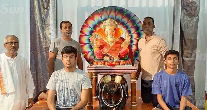 Left: Laxmi Narayan Temple priest, Shastri Jayendra with some members of the temple. Photo: Sanjeshni Kumar