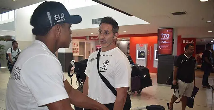 Fiji Airways Fiji men’s rugby sevens playmaker Napolioni Bolaca (left), with head coach Ben Gollings at Nadi International Airport on April 11, 2023. Photo: Mereleki Nai