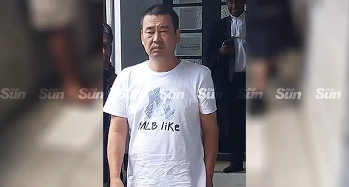 Bi Baodang (wearing white t-shirt) outside the High Court in Suva on November 21, 2022. Photo: Ashna Kumar