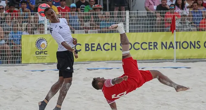Tahiti’s Patrick Tepa clears as Fiji’s Gabiriele Matanisiga closes in during the OFC Beach Soccer Nations Cup 2023, at Aorai Tini Hau in Papeete, Tahiti, on August 24, 2023.   Photo: Shane Wenzlick /www.phototek.nz