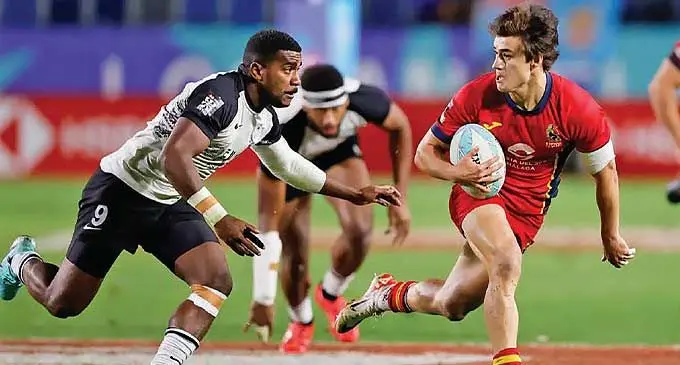 Filipo Bukayaro tries to stop the Spanish player who sealed their win over Fiji in the Cup quarterfinals during the Los Angeles 7s tournament. Photo: World Rugby
