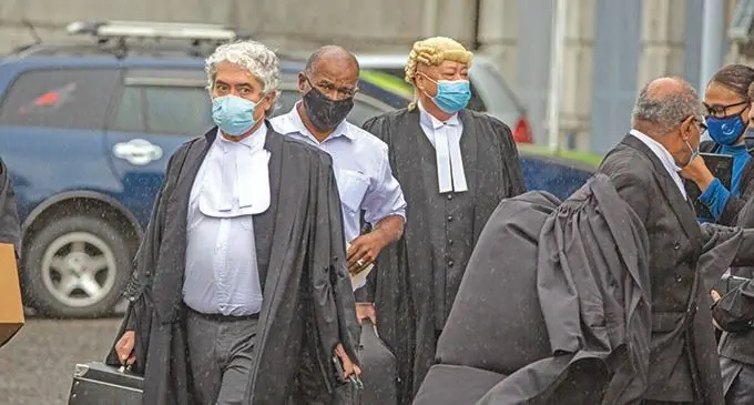 Former Opposition MP Niko Nawaikula (middle) with two of  his lawyers Jon Apted (front), Graham Leung (back) outside the High Court in Suva on August 11 2021.   Photo: Leon Lord