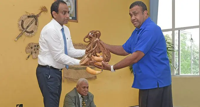 Permanent Secretary for Environment and Waterways Joshua Wycliffe hands over tabuas to Director for the Centre for Appropriate Technology Development based in Nadave Naipote Katonitabua, with Acting Permanent Secretary for iTaukei Affairs Meleti Bainimarama. Photo: DEPTFO News 