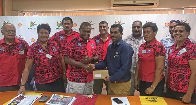 Marist Rugby Club president Lawrence Tikaram (fourth from left) receives the cheque from Pacific Energy Limited’s national retail manager Amit Maharaj (sixth from left) in Suva on March 15, 2019.
