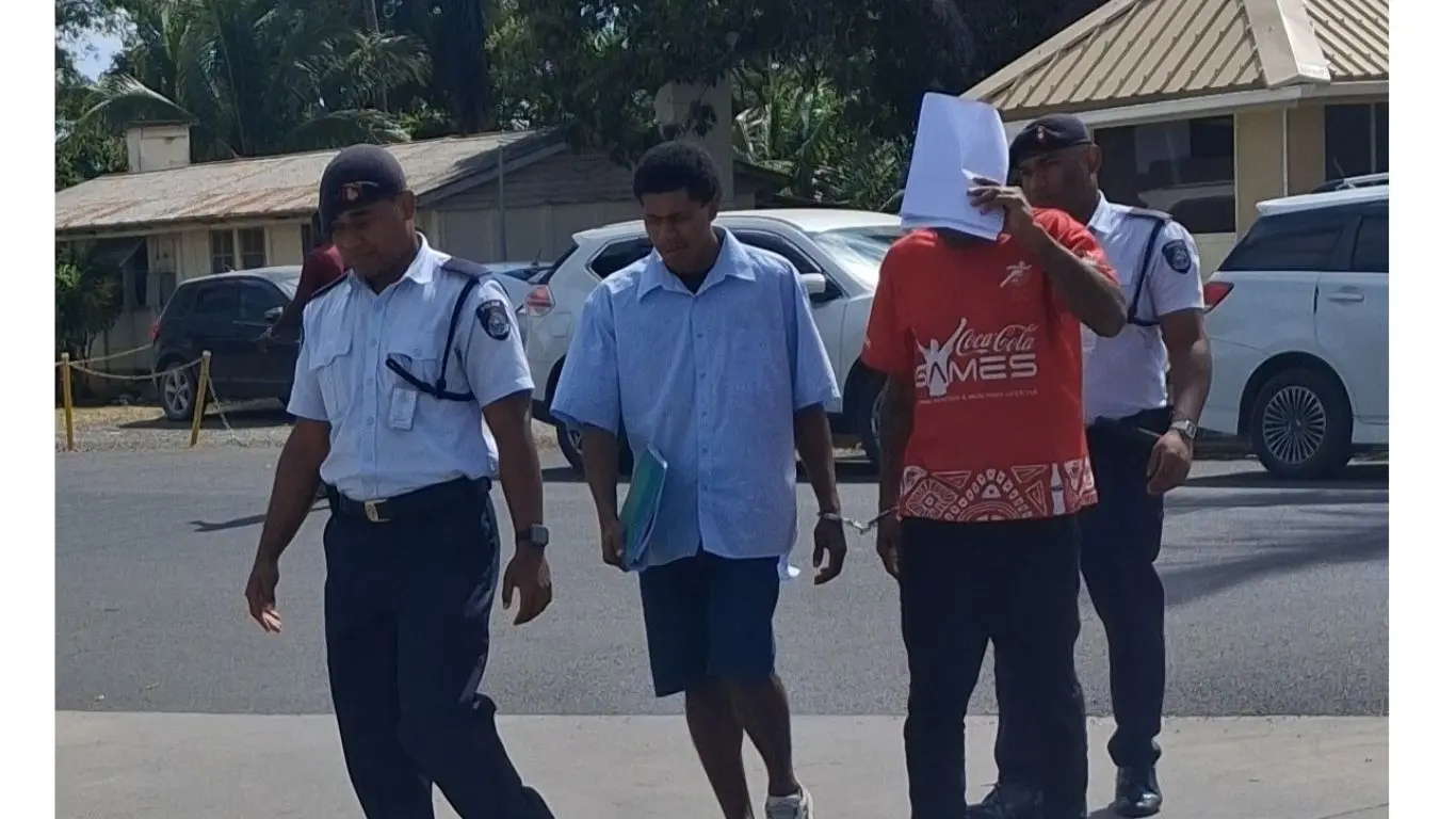 Murder accused Vereti Tavisoro (second from left). escorted by police officers to the Nadi Magistrate Court on August 3, 2026.