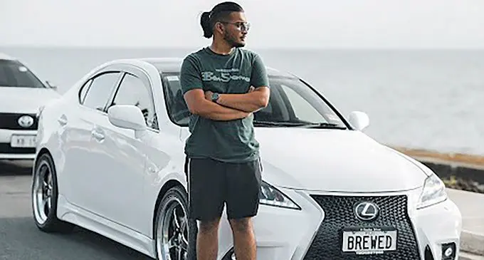 Rowan Chand beside his 2006 Lexus IS350. Photo: Craveshots Photography Fiji