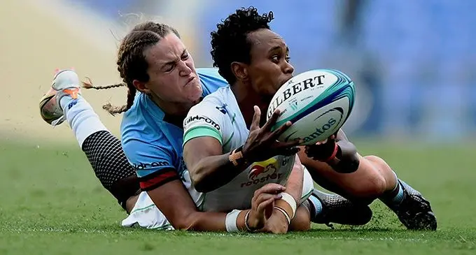 Rooster Chicken Fijiana Drua full-back Timaima Ravisa is tackled by a Waratahs player during their match at Cbus Stadium, Gold Coast on April 1, 2022. Fijiana Drua won 29-10.