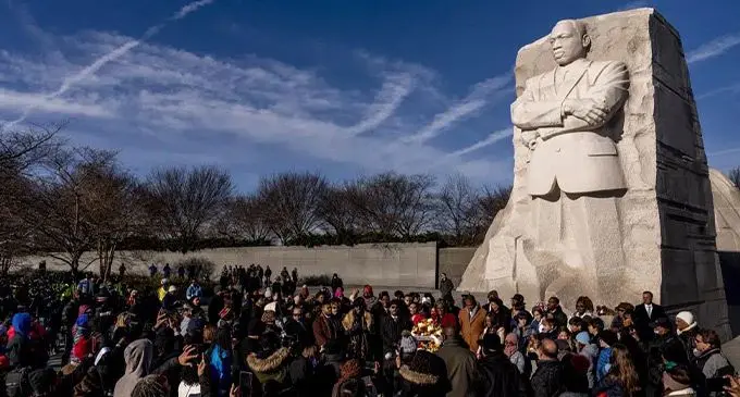 A large group gathers to watch a wreath-laying ceremony at the Martin Luther King Jr. Memorial on Martin Luther King Jr. Day in Washington, on January 16, 2023. Photo: AP