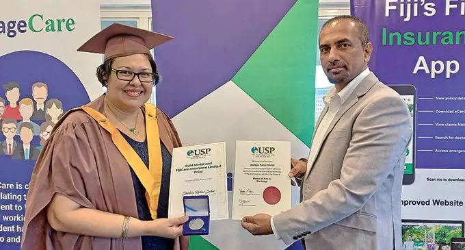 FijiCare Insurance Limited sponsored most outstanding Master of Arts thesis winner Shirleen Sahai with group chief financial officer of FijiCare Insurance Limited, Victor Robert on May 16, 2022. Photo: Sheenal Charan