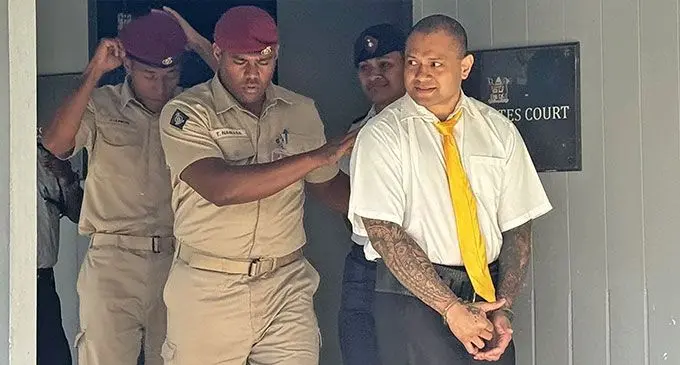 Convict Jone Vakarisi was escorted back to the Suva Corrections Centre at Korovou, Suva, after his case was acquitted at the Suva Magistrate’s Court yesterday. Photo: Asenaca Ratu