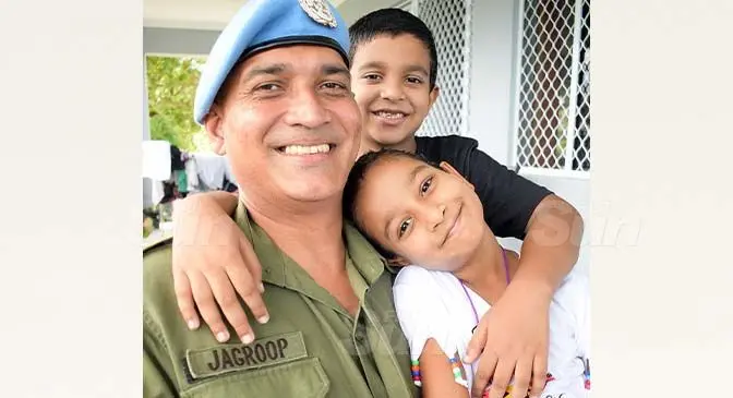 Major Anurag Jagroop, with his children, Seijal and Devansh Jagroop before departing from home on April 2, 2021. Photo: Ronald Kumar