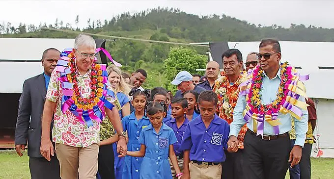 Australian High Commissioner to Fiji, Ewen McDonald (left, in bula shirt) and Deputy Prime Minister and Minister for Finance Biman Prasad (right) with students at Dreketi Primary School, Macuata on February 20, 2024. Photo: DEPTFO News
