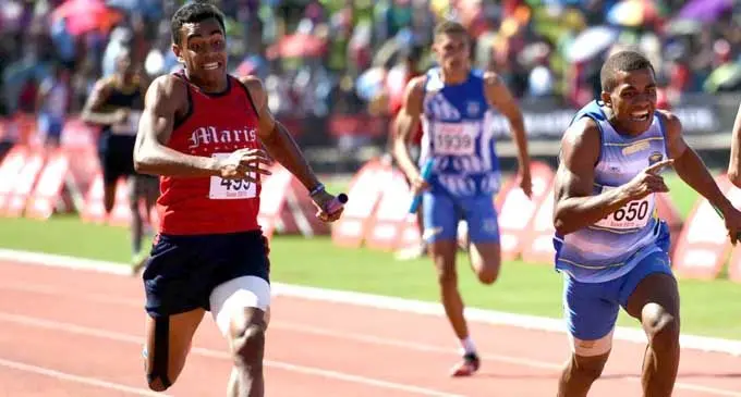 Ratunaisa Navuna (right), of Natabua High School wins the intermediate boys 4x100 relay yesterday despite the strong challenge from Marist Brothers High School.  Photo: Rama