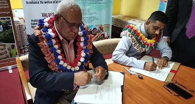 From left:  iTaukei Affairs Board permanent secretary Meleti Bainimarama and Fiji Competition Consumer Commission Commissioner Vimlesh Sagar during the MoU signing on August 5, 2019. 
