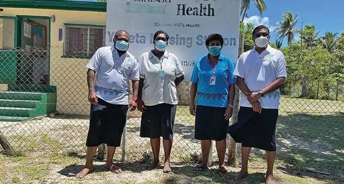 Minister for Health and Medical Services Dr Ifereimi Waqainabete (left) and Dr Jemesa Tudravu (right) with health officials in Yasawa.