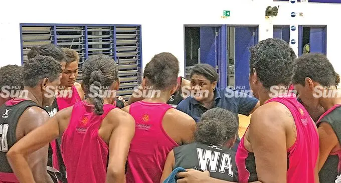 Fijian Pearls head coach, Unaisi Rokoura (facing camera) talks to the Pearls Selection team after their second game against Singapore at the FMF Gymnasium on June 1, 2022. Photo: Sereana Salalo