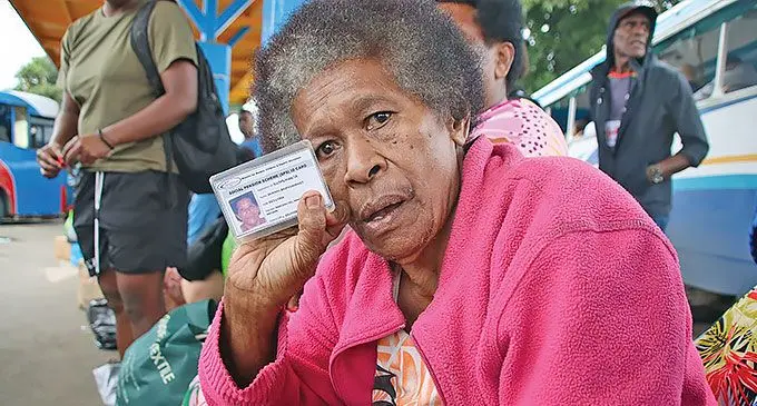 INSET: Sainimili Baleivunimaqo with her social welfare ID card.